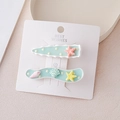Detalle de pinzas para el cabello con estrellas de mar y conchas en tarjeta - Estilo Estrella de mar Azul