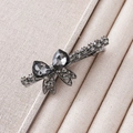 Detail of elegant black rhinestone bow hair clip with dark grey crystal elements - Black Rhinestone Bow Duckbill Style
