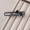 Detailed close-up of dark grey alloy hair clip with micro-set rhinestones and heart crystals - Black Heart Crystal Bow Style