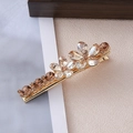 Detail of golden hair clip featuring floral crystal inlay and polished metal finish - Multi-Color Crystal Flower Gold Style