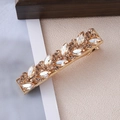 Detail of leaf-shaped gold hair clip with champagne and clear marquise rhinestones - Champagne Leaf Pave Duckbill Style