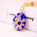 Exquisite blue enamel Easter egg keychain with gold flower patterns and blue rhinestones - Blue