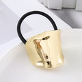 Golden irregular wavy metal hair tie with high elastic black rubber band in a dish - Gold Irregular Oval