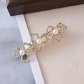 Detailed close-up of golden hair clip with crystal hearts and white faux pearls decor - Gold Hollow Heart & Five Pearls Style