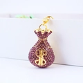 Golden money bag keychain with purple rhinestones and dollar sign charm accessory - Purple