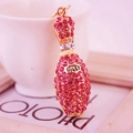 Pink rhinestone bowling pin keychain with gold metal base and Lucky engraving detail - Pink