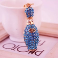 Golden bowling pin keychain with blue rhinestones and LUCKY engraving for bag charm - Blue