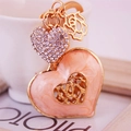 Elegant peach enamel heart keychain with rhinestones and gold rose flower pendant - Peach