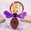 Creative crystal honey bee keychain with purple rhinestones and gold-plated finish - Purple