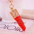 Exquisite gold alloy lipstick keychain with red enamel coating and crystal rhinestones - Orange