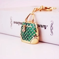 Golden handbag keychain pendant with green enamel scales and sparkling crystals - Green