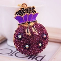Charming purple rhinestone money bag keychain with golden alloy and Chinese wealth character - Purple