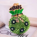 Green crystal lucky money bag keychain with gold plating and enamel flower - Green