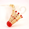 Porte-clés volant de badminton doré créatif avec des strass rouges étincelants - Rouge