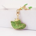Portachiavi a cappello da cowboy in lega dorata con strass verdi brillanti e moschettone - Verde