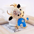 Colorful cartoon ox keychain with white rhinestones and blue enamel on gold metal base - Blue