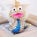 Cartoon snake keychain with white rhinestones and blue enamel on a gold metal base - Blue