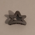 Detailed view of a dark brown star-shaped hair claw clip with a matte textured finish - Pentagram / Brown