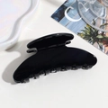 Detail of a glossy black large hair claw clip for elegant women styling - Black