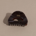 Detail view of tortoiseshell acetate hair claw with gold France Handmade lettering - Dark Brown