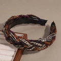 Detail of multi-colored knitted headband with non-slip teeth and braided wool texture - Khaki
