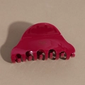 Detail of a magenta acetate hair claw clip featuring the golden Barrette La France text - Red