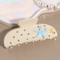 Detail der cremefarbenen Haarklammer mit blauen Seestern-Elementen und Glitzersteinen - Seestern Beige