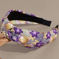 Detail of grey knotted headband with purple stars and golden festive patterns - Purple Star Festival Style