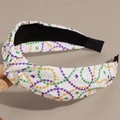 Detail of knotted headband featuring vibrant purple green and gold pearl pattern prints - Colorful Pearl Chain Style