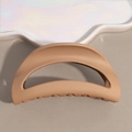 Detail of matte brown shark hair claw clip with smooth curved design and anti-slip teeth - Khaki