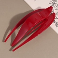Detailed top view of large red minimalist hair claw clip with sleek streamlined petals - Red