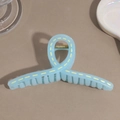 Detail of light blue jelly hair claw clip with yellow dashed lines and golden spring - Blue