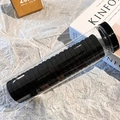 Schwarze elastische Haargummis in einem transparenten Zylinder mit schwarzem Deckel - Schwarz