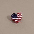 Macro view of heart-shaped hair claw clip with American flag pattern and red glitter finish - Heart Stripe Red Base