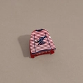 Detail of creative sweater-shaped hair claw with US flag eagle print and red glitter finish - Clothes Style Red Base
