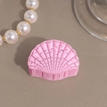 Detail view of pink scallop-shaped hair claw with matte shell texture and pearl decor - Pink Small Shell