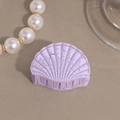 Detail view of shell-shaped hair claw in lavender matte acrylic with gold trim - Purple Small Shell