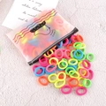 Elastici per capelli colorati senza cuciture sparsi da una borsa a tema anatra - Serie Gialla