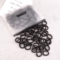 Set di 100 elastici per capelli neri senza cuciture con sacchetto smerigliato con anatra - Serie Nera