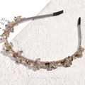 Close-up of baroque crystal headband with champagne and smoky grey rhinestones - Gray