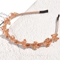 Detailed macro view of baroque headband with champagne crystals on a marble stone surface - Champagne Pink