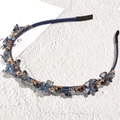 Detail of baroque crystal headband featuring blue faceted beads on a satin wrapped band - Navy Blue