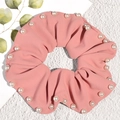 Pink coral pleated scrunchie with white pearl accents and soft textured fabric for women - Pink