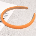 Detail of vibrant orange padded headband showing soft knit fabric and velvet lining - Orange (1.2cm)