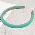 Detail of mint green fabric headband with non-slip brown lining on a textured surface - Lake Green (1.2cm)