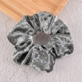 Close-up detail of silver-grey velvet scrunchie showing its soft texture and sheen - Gray
