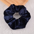 Macro shot of dark blue velvet fabric texture and sheen on a premium hair scrunchie - Navy Blue
