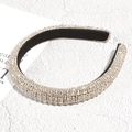Detail of a padded headband with silver rhinestones and a black velvet inner lining - Silver White