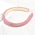 Detalle de una diadema acolchada rosa con cristales brillantes y diseño de lujo real - Rosa con Cristales Completos