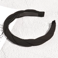 Detail of black braided headband with non-slip inner teeth and soft fabric texture - Black